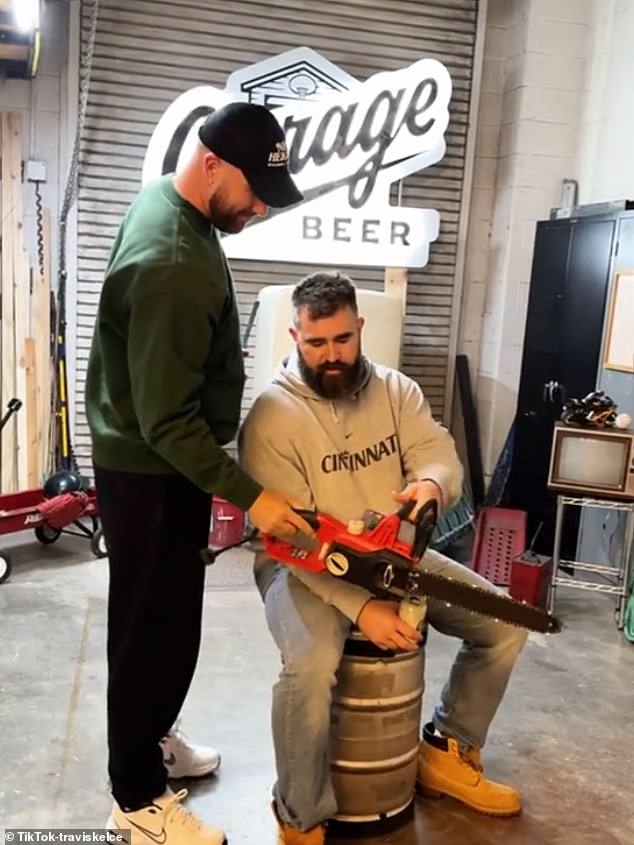 The tight end also got a chainsaw and gave it to his brother to pose with.