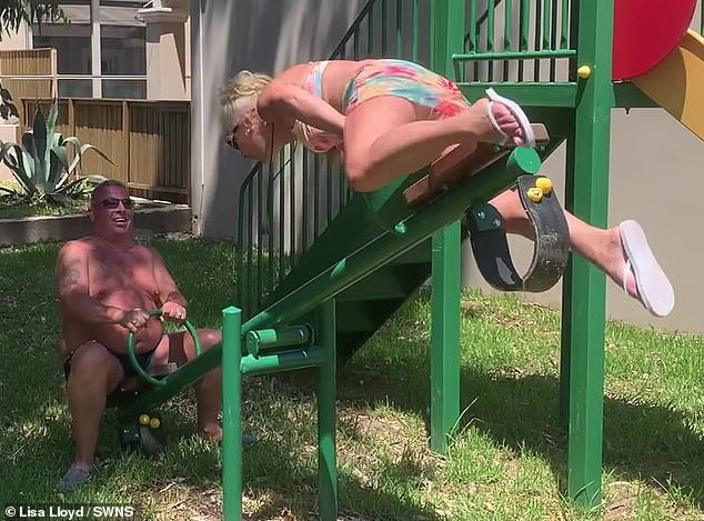 Lisa and her husband tested the seesaw so they could show pictures to their grandchildren once they were home.