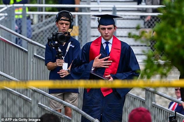 Barron Trump participating in his graduation at Oxbridge Academy in West Palm Beach, FL.