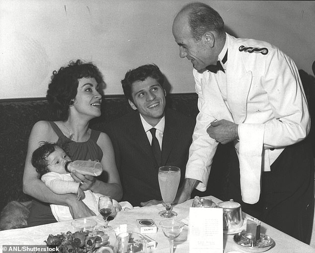 The couple is photographed with their daughter Lisa in 1958.