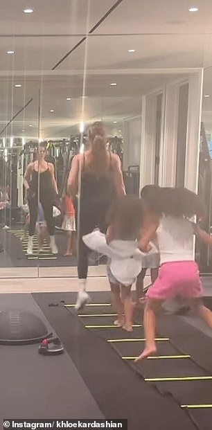 As Khloé jumped down an agility ladder, her daughter and nieces could be seen trying to imitate her by running after her.