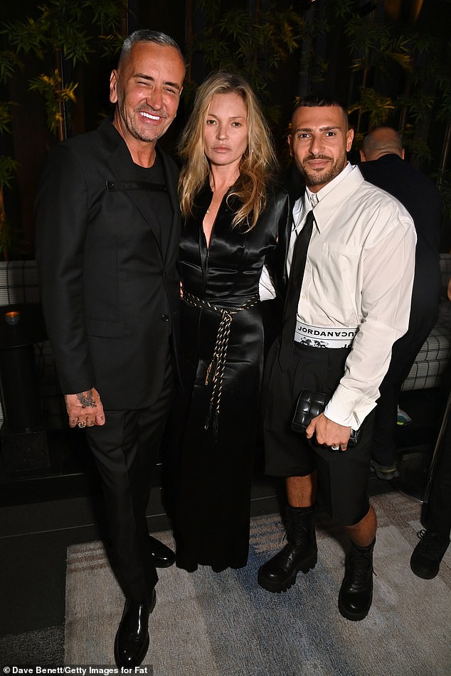 The supermodel was also photographed while attending an engagement party for her friends Fat Tony and Stavros Agapiou in London in May (pictured left to right: DJ Fat Tony; Kate Moss; Stavros Agapiou).