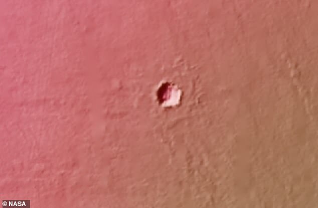 Scientists aren't sure how deep the holes on Mars (pictured) are. They believe they were formed after a volcanic explosion caused lava tubes to form.