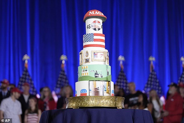 Club 47 organizers brought out a six-tier cake that included scenes of the Oval Office and the golf course, as well as a bright red MAGA hat.