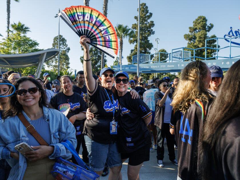 Dodger fans Denise (left) and Colleen Quinn-Allen enjoy Pride Night at Dodger Stadium.