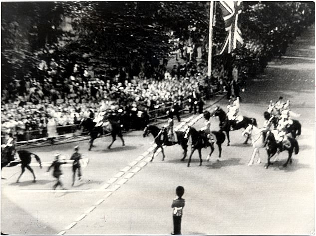 The moment after Marcus Sarjeant fired blank shots at the Queen during Trooping the Color