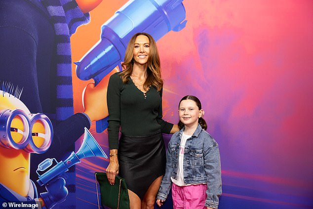 She hugged her daughter as the couple posed on the red carpet before the popular children's movie.