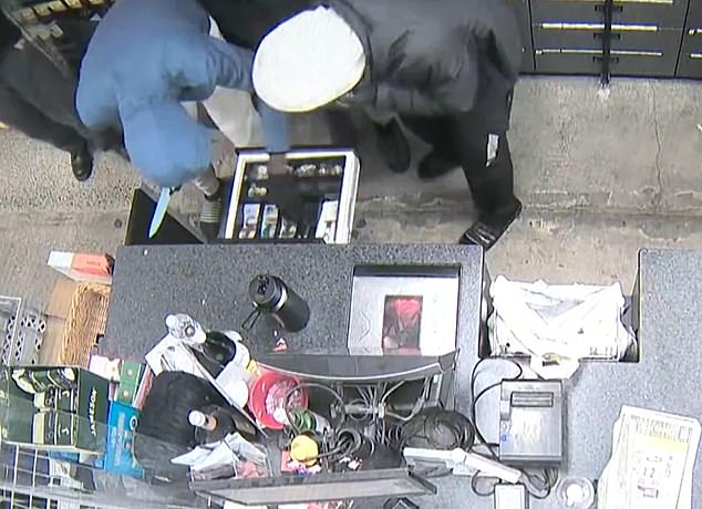 CCTV footage shows the men jumping over the counter of an IGA supermarket in Cheltenham, South Melbourne, and assaulting a worker at 4pm.