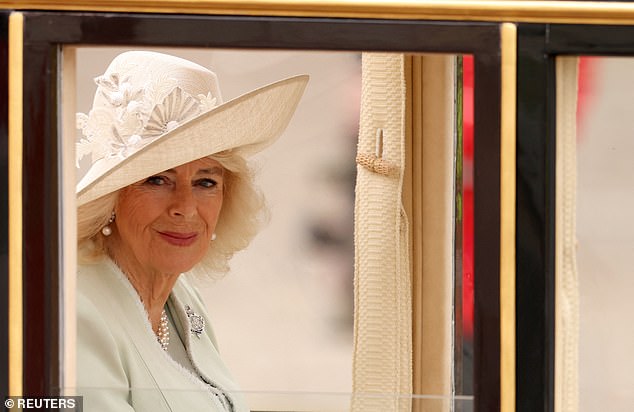 The Queen looked resplendent in a pale blue suit and matching hat, while Kate looked cheerful in a coordinated white ensemble.