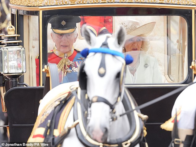 King Charles III and Queen Camilla travel down The Mall to the Trooping the Color ceremony