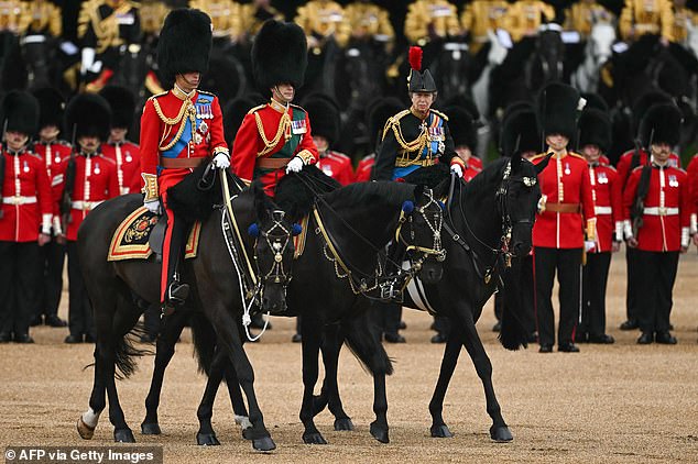 Prince William, Prince of Wales, Prince Edward, Duke of Edinburgh and Princess Anne, Princess Royal, perform at the Horse Guards Parade