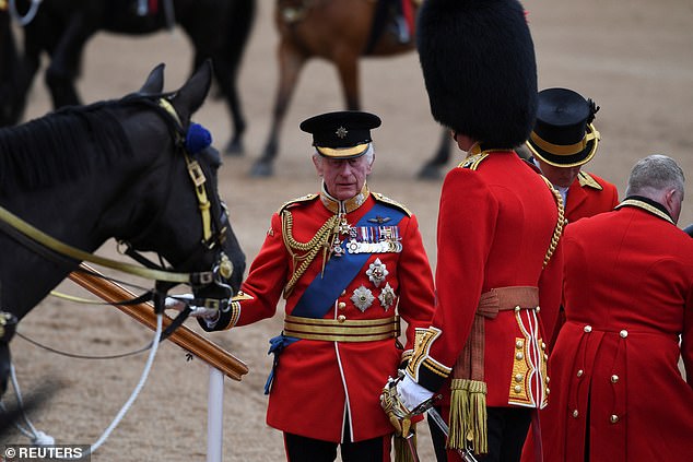 Britain's King Charles arrives for the Trooping the Color parade honoring his official birthday