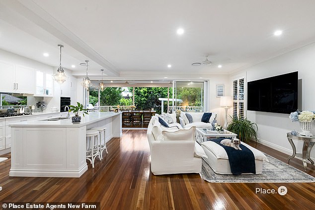 Designed in the popular 'Hamptons' holiday home style, the home was built specifically for Ariarne's parents, Steve and Robyn. Pictured: the beautiful kitchen with an adjoining entertainment platform