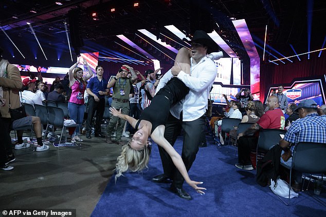 Robert Broderick and Rachel dance before the start of the Turning Point Action conservative grassroots convention in Huntington Place, Detroit, Michigan.