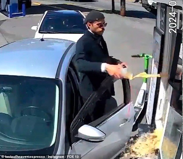 The male customer is seen standing outside his car throwing his drinks at a bikini-clad Lee during their heated exchange on Tuesday.