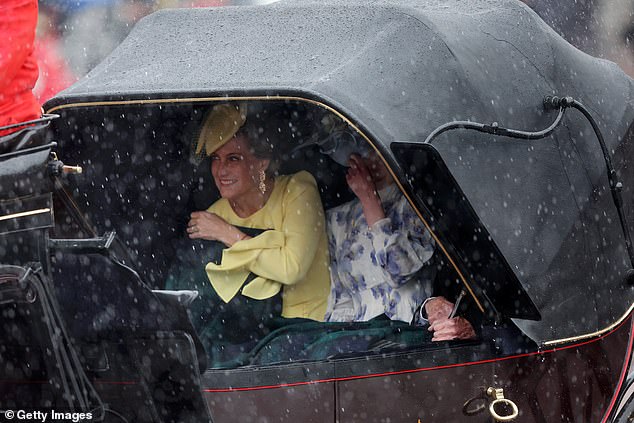 Sophie and Louise take shelter under their carriage as London experiences heavy rain.