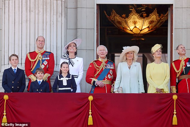 Members of the Royal Family watch the flight from the balcony of Buckingham Palace today.