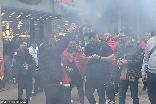 The fans, who had earlier lit gray and red flares, were later searched for weapons.