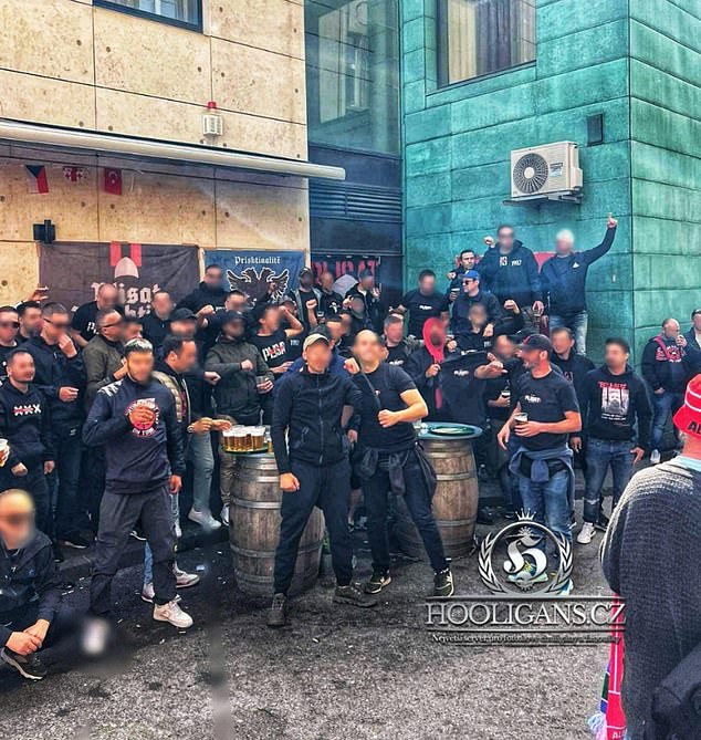 Thugs dressed in black went on a rampage this afternoon in the center of Dortmund, attacking a fast food restaurant and then clashing with riot police.