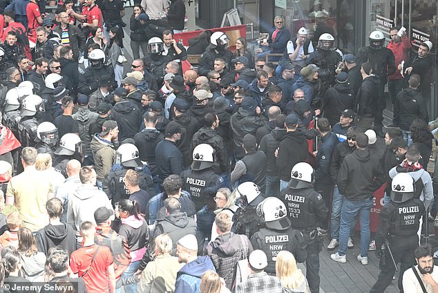 Police surround Albanian ultras after violence broke out for the first time at Euro 2024 today when more than 100 Albanians tried to attack Italian fans.