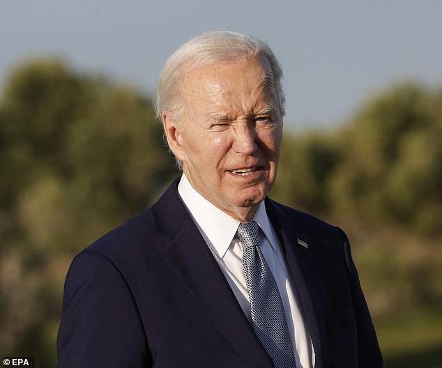 US President Joe Biden attends a flag ceremony during the G7 summit