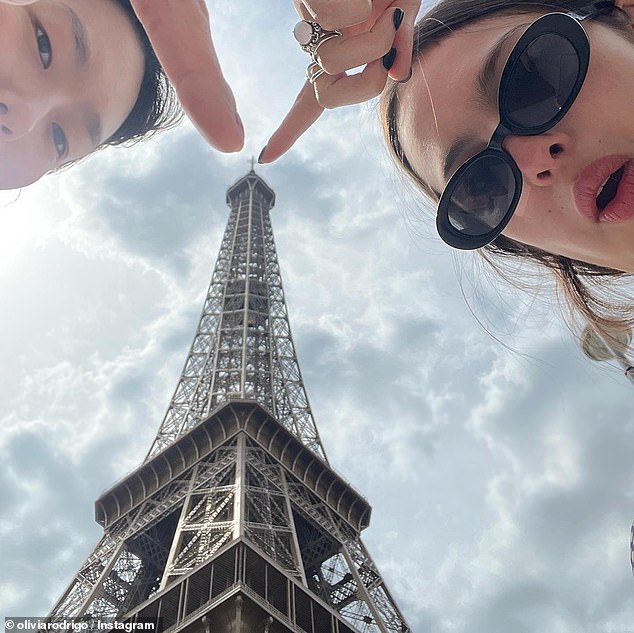 The three-time Grammy winner gave her 37.4 million Instagram followers a glimpse into her trip as she shared a selfie with her friend Madison Hu at the Eiffel Tower.