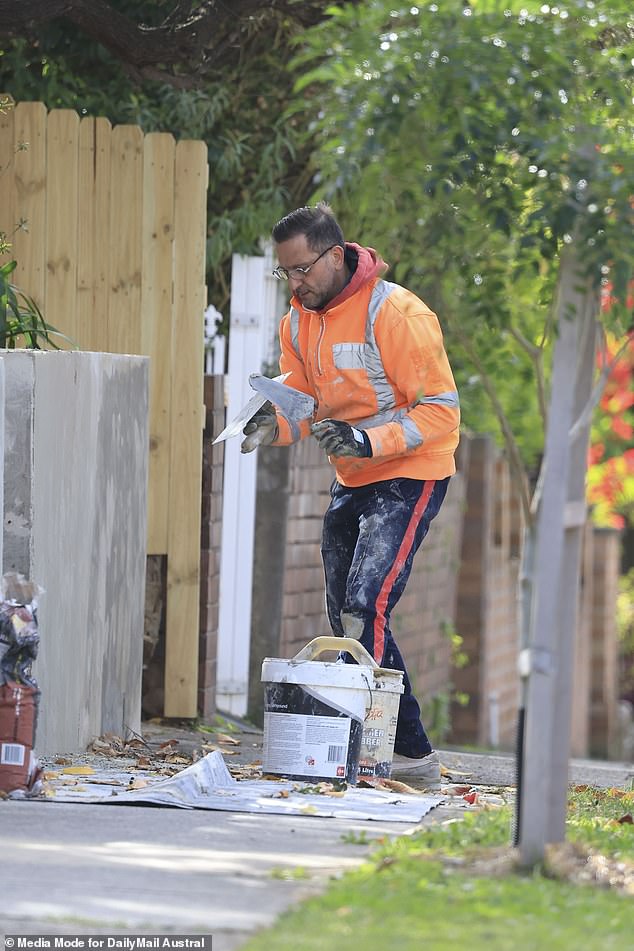 Salvatore Coco was photographed working on a concrete wall at a property in Sydney's inner west on Wednesday.