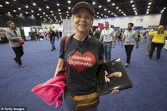 A supporter of former President Donald Trump wears a "adorable deplorable" t-shirt, a reference to Hillary Clinton's comment about Trump supporters, on Turning Point Action's "The popular convention" June 15, 2024 in Detroit