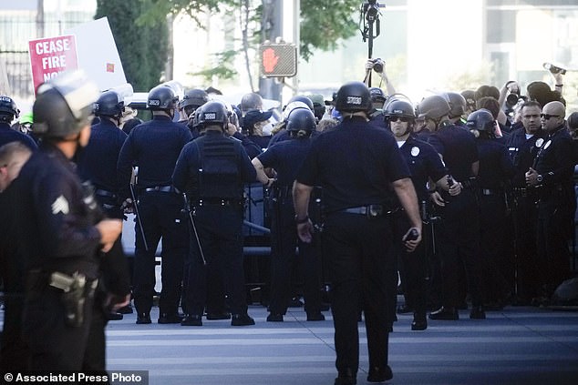 Law enforcement officers responded to protesters near the campaign event.