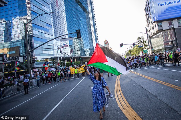 As in many other demonstrations this year, protesters could be seen waving Palestinian flags.