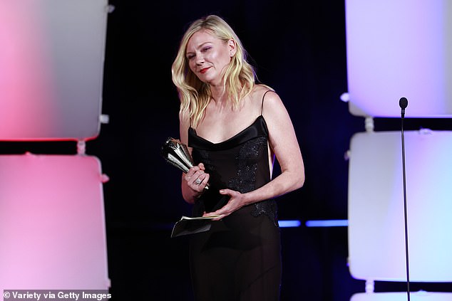 The Academy Award nominee appeared in high spirits as she was seen giving a speech and then holding up the award to give to the night's next winner.