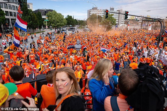 Around 40,000 Dutch supporters were taking part in a peaceful march when a man wielding a golden ax began attacking an officer.