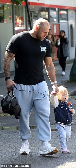 He added some cozy white sneakers that kept him comfortable for his daily walk.