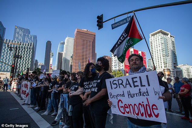 Pro-Palestinian protesters in Los Angeles carried signs and waved flags as Biden and Obama cracked jokes with comedian Jimmy Kimmel inside the Peacock Theatre.