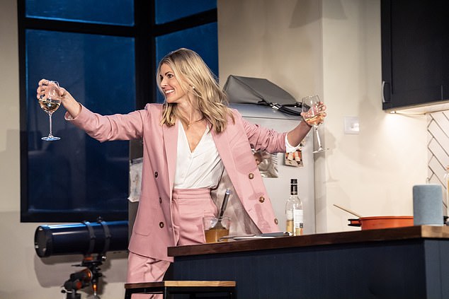 Lauren provides the comic relief to the piece and taking on the role, '90s TV host Donna Air looked overjoyed as her character held two glasses of wine.