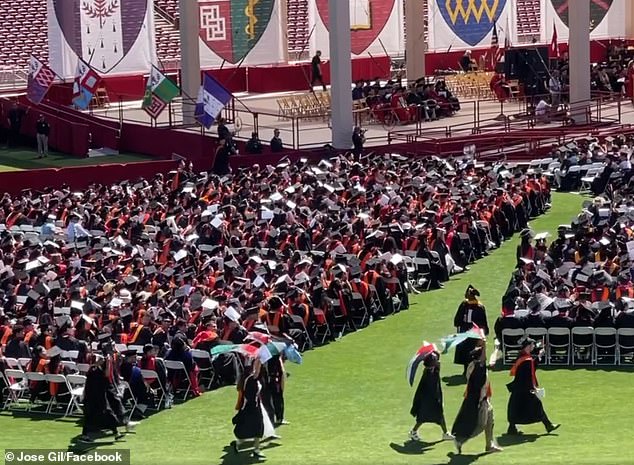 The students were seen wearing keffiyehs and waving Palestinian flags.