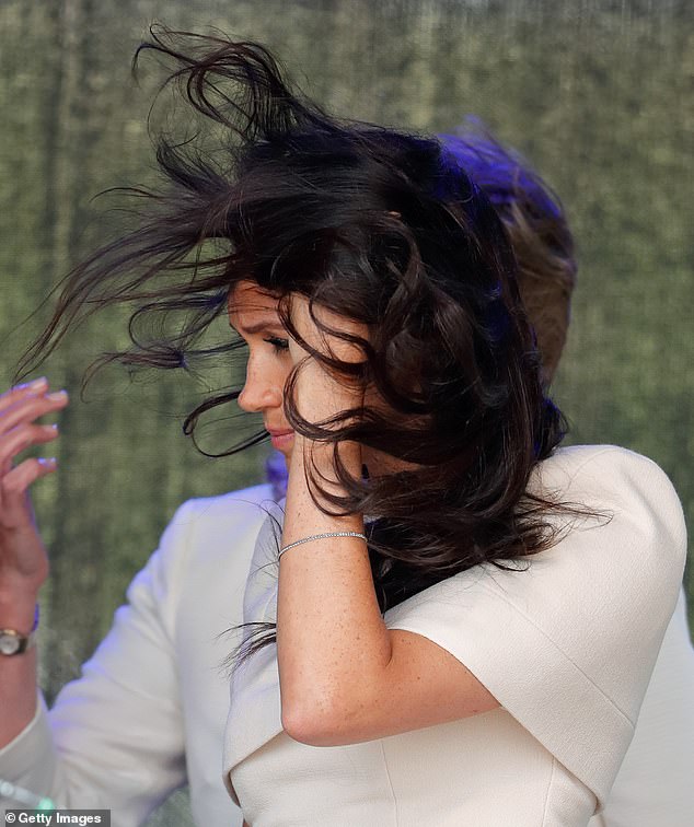 Meghan Markle appears windswept while attending a ceremony to open the new Mersey Gateway Bridge in 2018