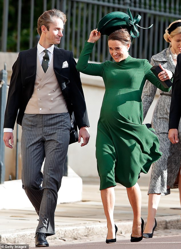 Pregnant Pippa Middleton catches her hat just in time