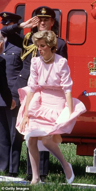 Princess Diana's skirt is blown up by a gust of wind after a helicopter ride in 1985.