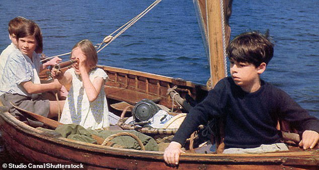 The former child star, who played Titty Walker (pictured second right in the film) brought back souvenirs from the set, including pirate flags and a bow and arrow.