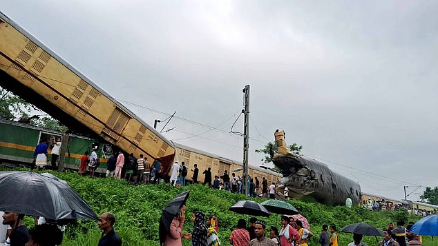 Shocking images show carriages suspended in the air after the tragic train crash