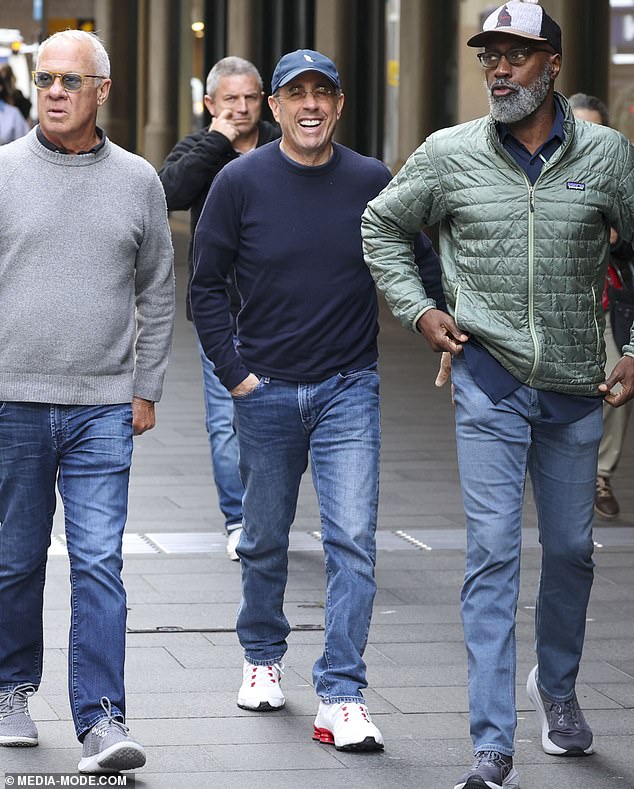 The comedian was all smiles as he headed out to do some shopping in Sydney's CBD.