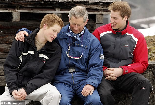 Then-Prince Charles poses for photographs with Prince Harry and Prince William during the Royal Family's ski holiday in Klosters in 2005.