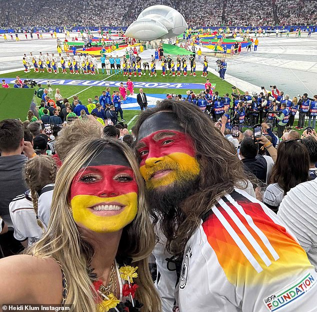 Heidi dressed up in face paint in the colors of the German flag with her husband Tom Kaulitz as they watched their home country beat Scotland 5-1 on Friday at the Allianz Arena in Munich.