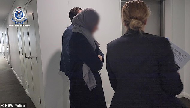 Zahra Rachid (pictured during her arrest) was charged with 16 counts of dishonestly obtaining financial advantage by deception.