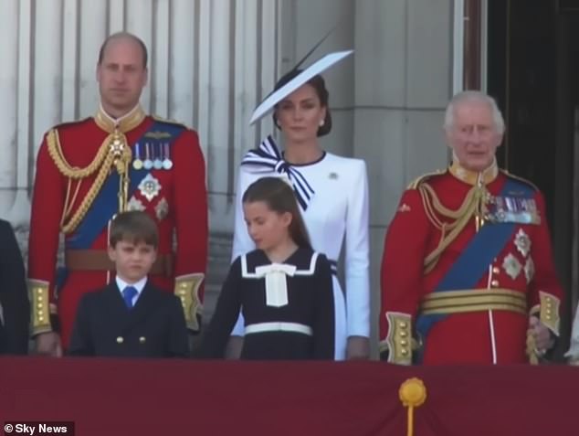 As the national anthem began to play, Princess Charlotte was seen telling her brother that 