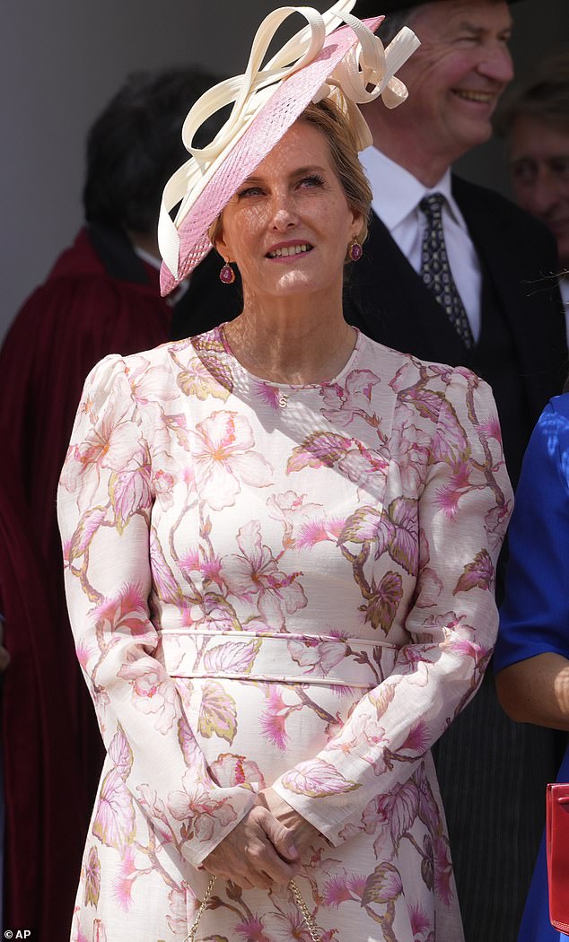 The royal, 59, stunned in a gorgeous combination of cream, pink and peach colors as she arrived at the traditional service held at St. George's Chapel.