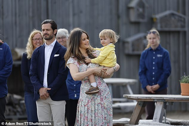 Princess Sofia, who for the occasion wore a floral top and a matching skirt, was proud of her youngest son while holding him in her arms.