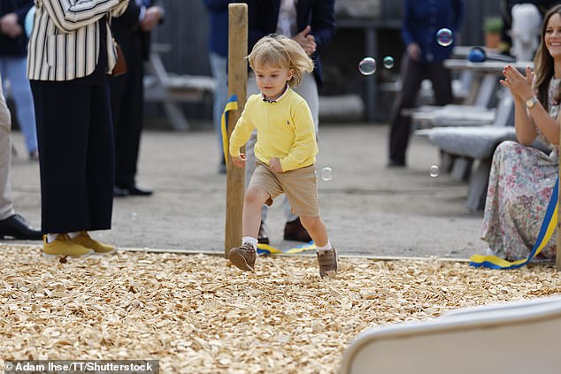 The lively prince wasn't afraid to try all the activities on offer at the new playground.