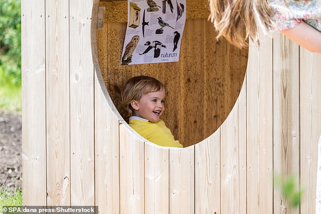 A laughing Prince Julian hid in Wendy's wooden house at one point while his mother, Princess Sofia, looked on.